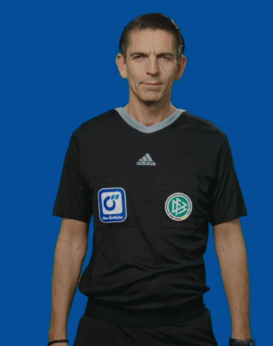 A Man Wearing A Black Adidas Shirt Makes A Funny Face GIF