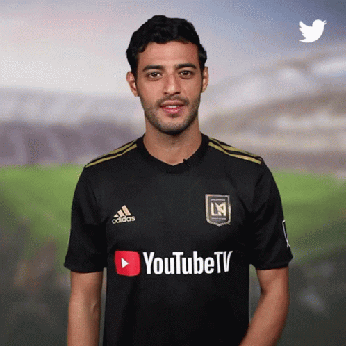 A Man Wearing A Black Adidas Shirt With Youtube Tv Written On It GIF