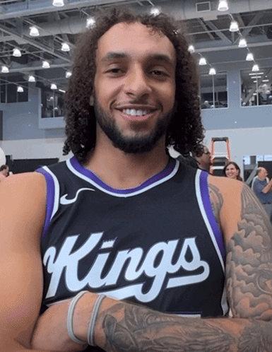 A Man Wearing A Black And Purple Jersey That Says Kings GIF
