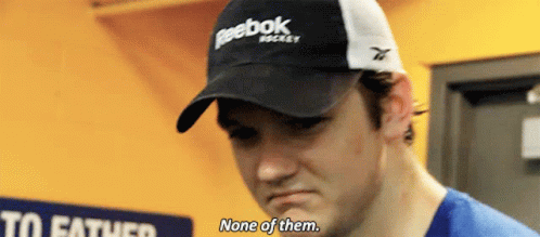 A Man Wearing A Black And White Reebok Hat Says None Of Them GIF
