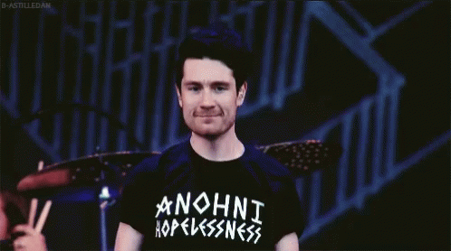 A Man Wearing A Black Anohni Hopelessness Shirt GIF