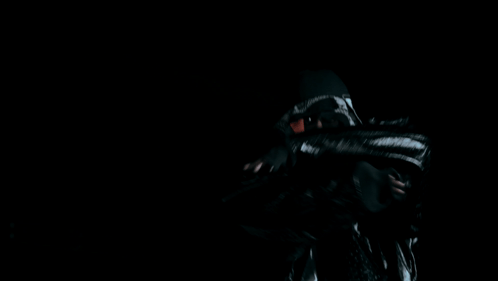 A Man Wearing A Black Hat And A Black Jacket GIF
