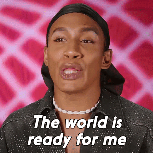 A Man Wearing A Black Hat And A Pearl Necklace Says The World Is Ready For Me GIF