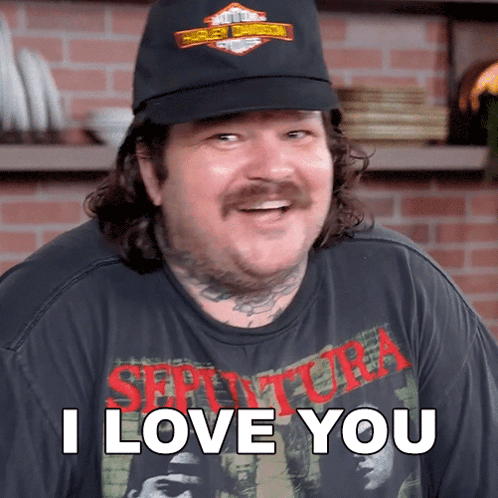 A Man Wearing A Black Hat And A Shirt That Says I Love You GIF