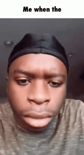A Man Wearing A Black Hat Is Making A Funny Face With The Words Me When The Below Him GIF