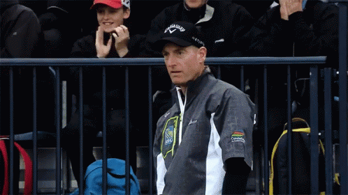 A Man Wearing A Black Hat That Says Callaway Is Smiling GIF