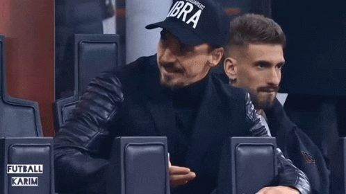 a man wearing a black hat that says ibra on it