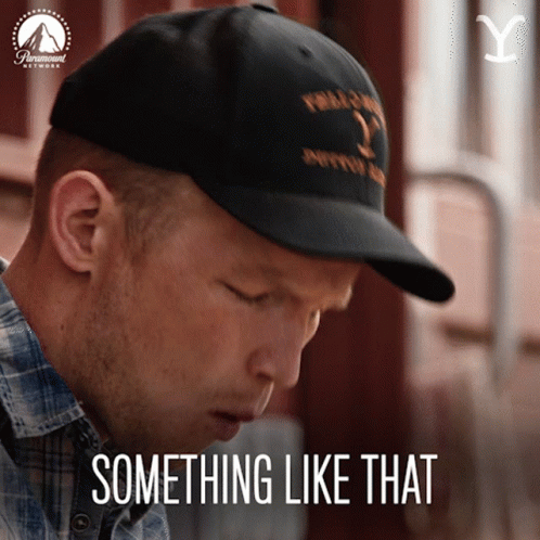 A Man Wearing A Black Hat With The Words Something Like That On It GIF
