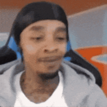 A Man Wearing A Black Headband And Headphones Is Sitting In A Chair . GIF