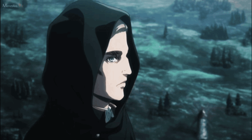 A Man Wearing A Black Hooded Cape Is Looking At Something In The Distance GIF