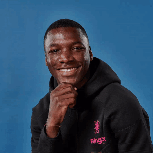 A Man Wearing A Black Hoodie That Says Bingx On It GIF