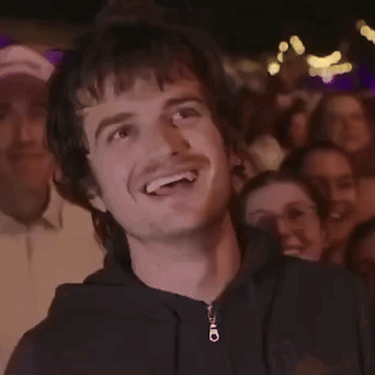 A Man Wearing A Black Hoodie With A Zipper That Says ' O ' On It GIF