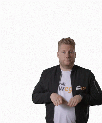 A Man Wearing A Black Jacket And A White Shirt Has His Arms In The Air GIF