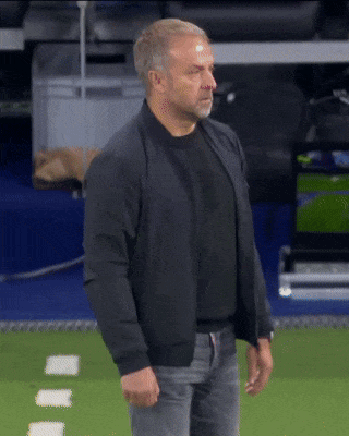 A Man Wearing A Black Jacket Stands On A Field GIF
