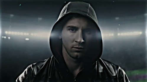 A Man Wearing A Black Jacket With A Hood GIF