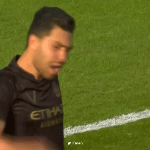 A Man Wearing A Black Jersey With The Name Petros On It GIF