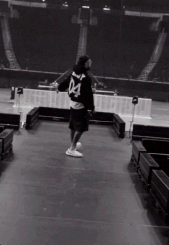 A Man Wearing A Black Jersey With The Number 04 On The Back GIF