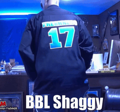 A Man Wearing A Black Jersey With The Number 17 On The Back GIF