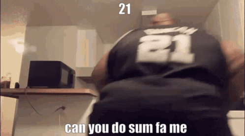 A Man Wearing A Black Jersey With The Number 21 On The Back GIF