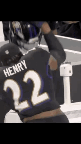 a man wearing a black jersey with the number 22 on it