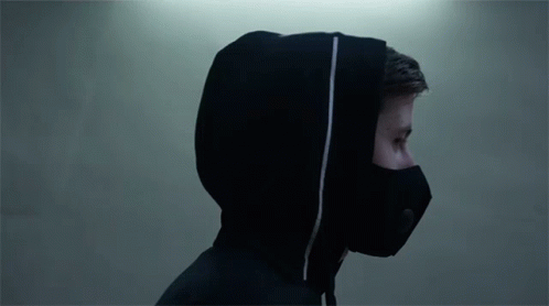 A Man Wearing A Black Mask And A Hooded Jacket GIF