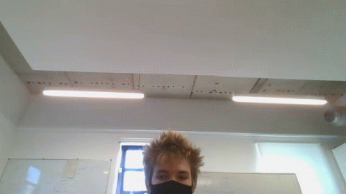 Man In Black Mask Standing In Front Of Whiteboard GIF