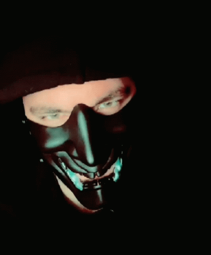 A Man Wearing A Black Mask With The Words " Behave Yourself " On The Bottom GIF