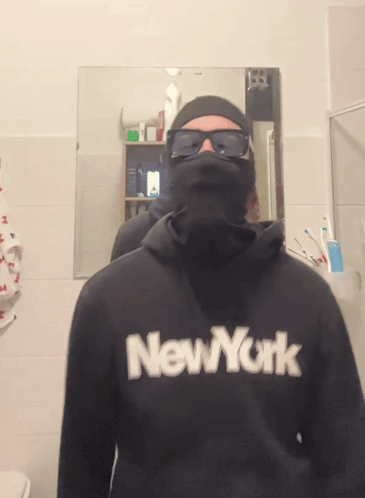 A Man Wearing A Black New York Sweatshirt GIF