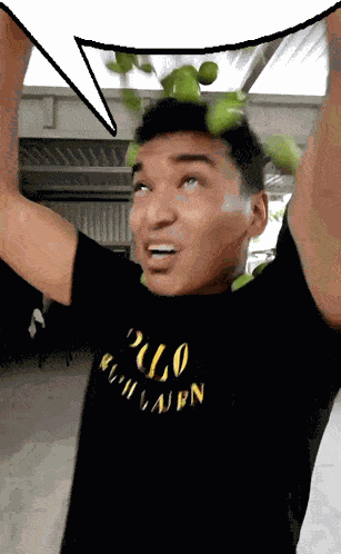 A Man Wearing A Black Polo Ralph Lauren T-Shirt Holds Up His Arms GIF
