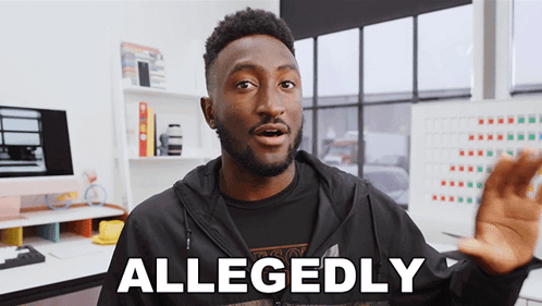 A Man Wearing A Black Shirt And A Black Jacket Says Allegedly GIF
