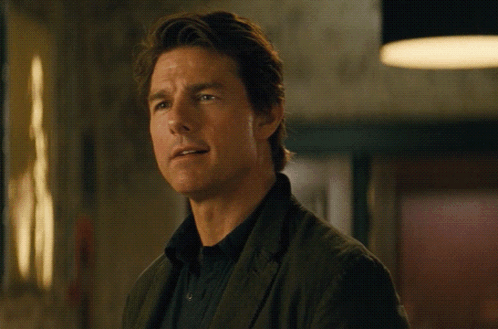 A Man Wearing A Black Shirt And A Brown Jacket GIF