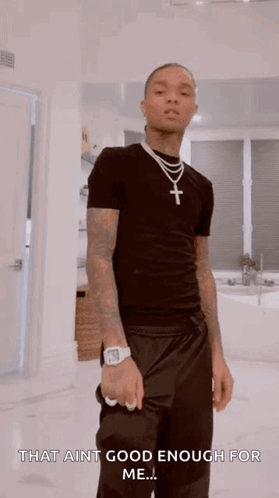 A Man Wearing A Black Shirt And A Cross Necklace Says That Ain T Good Enough For Me .. GIF