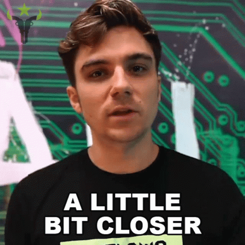 A Man Wearing A Black Shirt Says A Little Bit Closer GIF