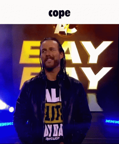 Man In Black Shirt Standing In Front Of Cope Sign GIF