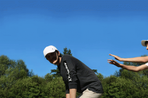 A Man Wearing A Black Shirt That Says " America " On The Arm GIF
