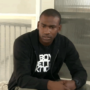 A Man Wearing A Black Shirt That Says Boy Kno GIF