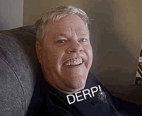 A Man Wearing A Black Shirt That Says Derp On It GIF