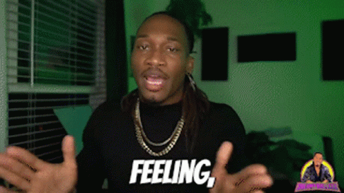 A Man Wearing A Black Shirt That Says Feeling On It GIF