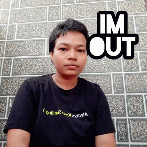 A Man Wearing A Black Shirt That Says ' Gniiim2 ' On It GIF