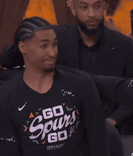a man wearing a black shirt that says go