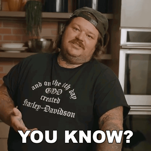 A Man Wearing A Black Shirt That Says Harley Davidson GIF