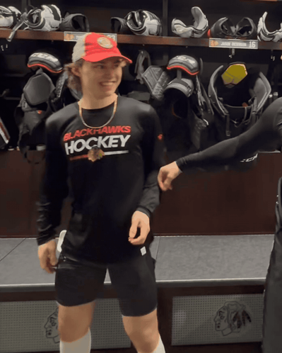 A Man Wearing A Black Shirt That Says Hockey GIF