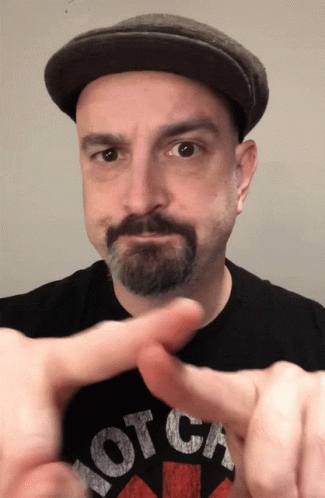 A Man Wearing A Black Shirt That Says Hot Ca GIF