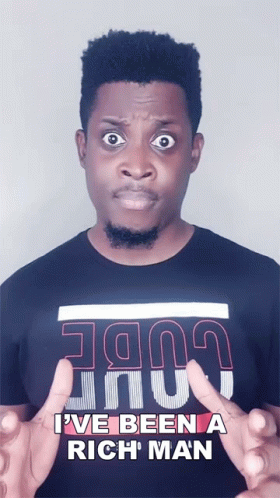 A Man Wearing A Black Shirt That Says I Ve Been A Rich Man GIF