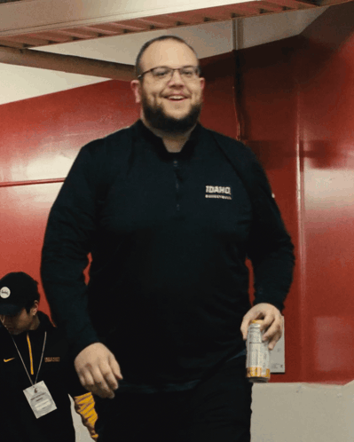 a man wearing a black shirt that says idaho