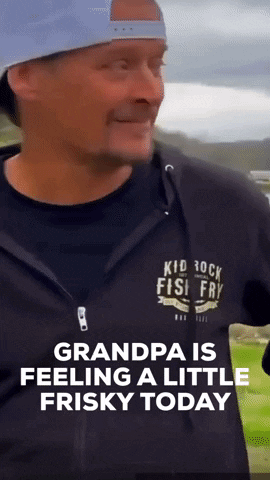 A Man Wearing A Black Shirt That Says Kid Rock Fish Fry On It GIF