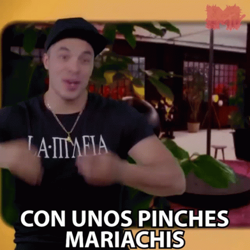 a man wearing a black shirt that says la mafia is dancing