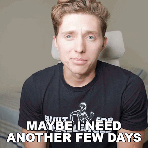 A Man Wearing A Black Shirt That Says " Maybe Need Another Few Days " GIF