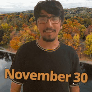 a man wearing a black shirt that says november 30 on it