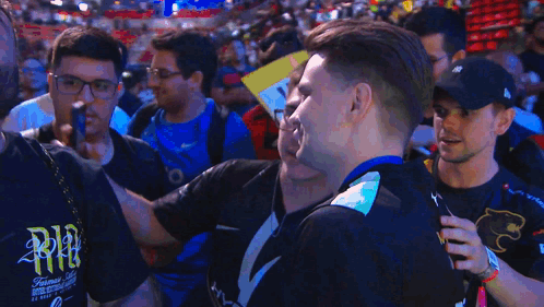 A Man Wearing A Black Shirt That Says Nvidia Smiles In Front Of A Crowd GIF